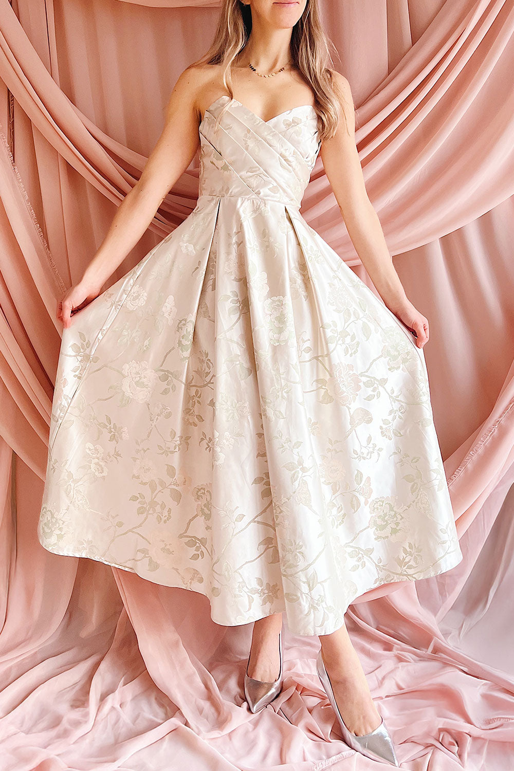 Front view of a woman wearing the Isolienne Midi Cream Strapless Dress from Boudoir 1861