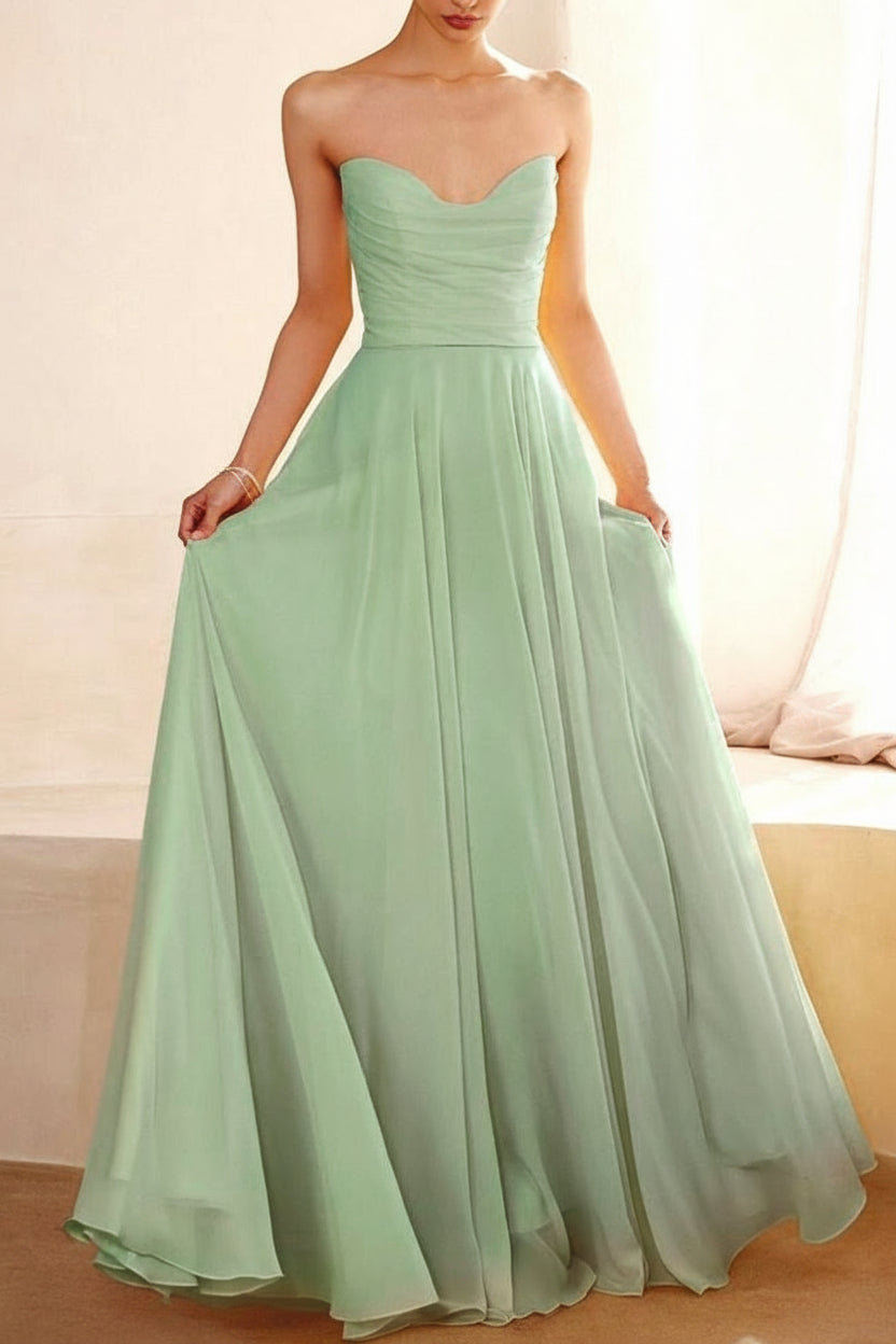 Person wearing Janie Sage Chiffon Maxi Dress with Neck Scarf from Boutique 1861 backview