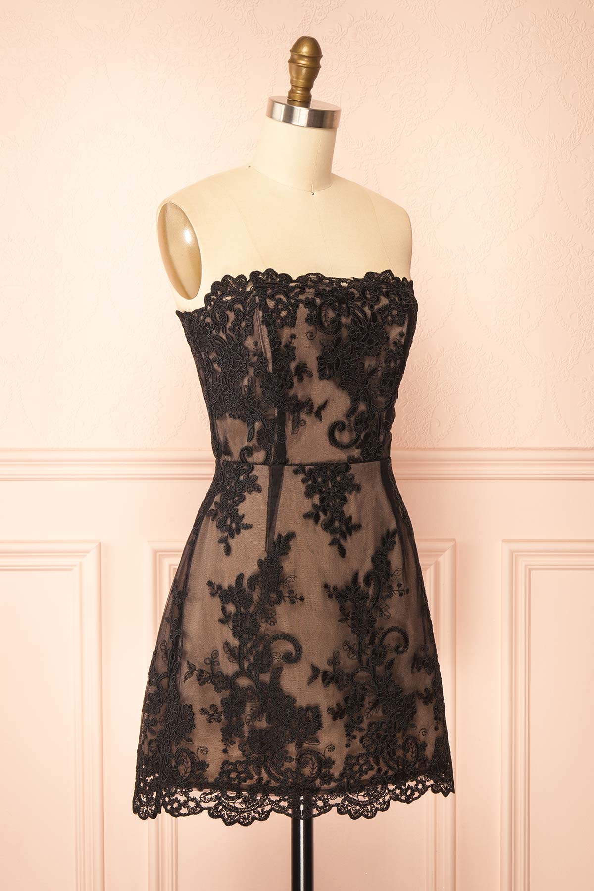 Side view of Konilda Black Floral Lace Mini Dress with Boned Bodice at Boutique 1861