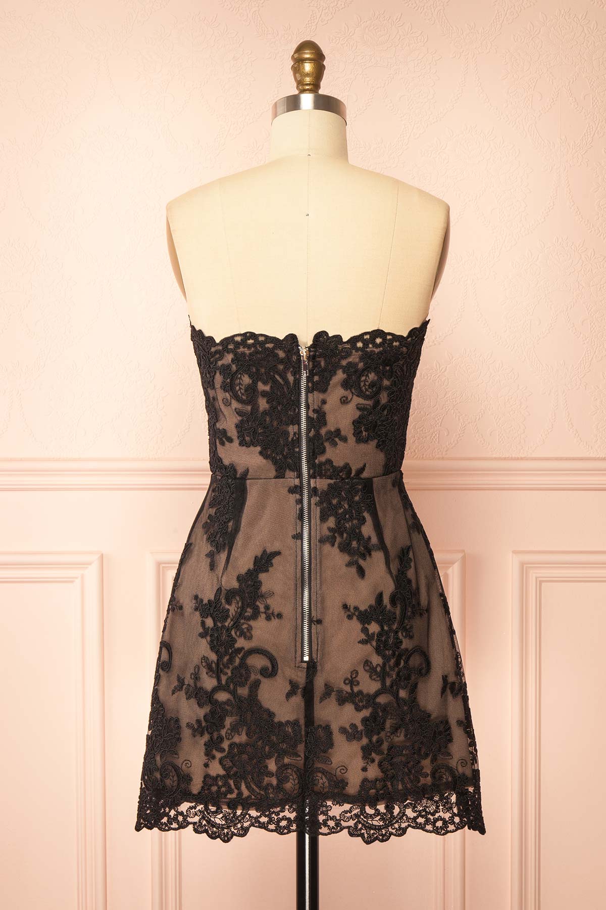 Back view of Konilda Black Floral Lace Mini Dress with Boned Bodice at Boutique 1861