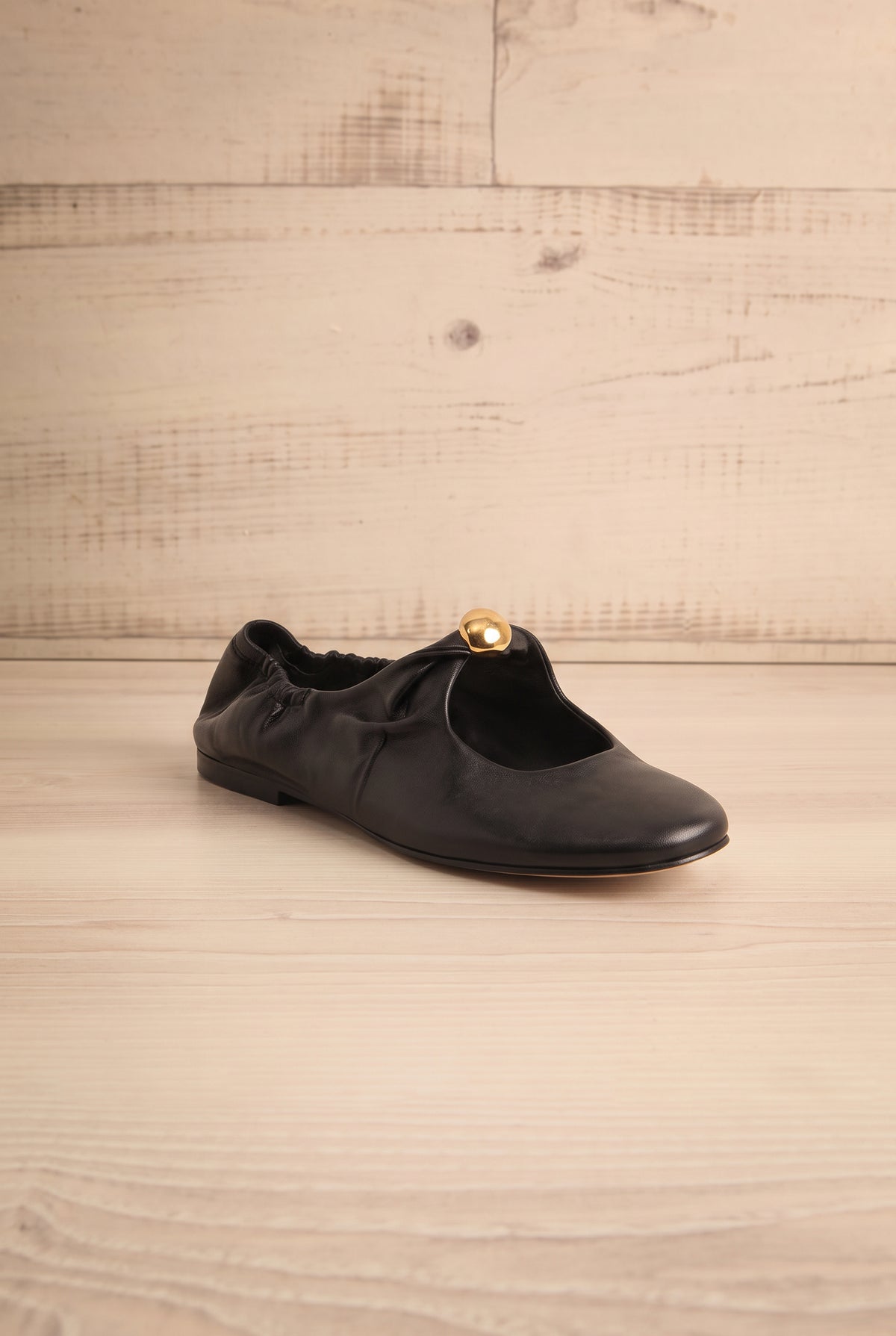 front view of Kornela Black Leather Ballet Flat Shoes at La petite garçonne