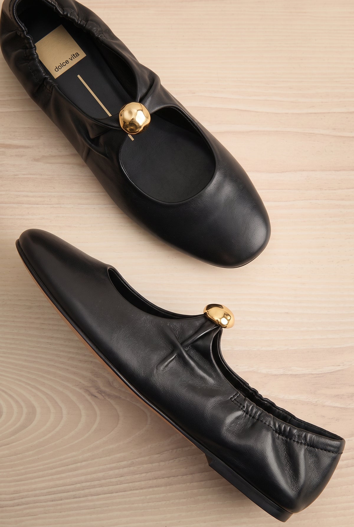 flat lay of Kornela Black Leather Ballet Flat Shoes at La petite garçonne