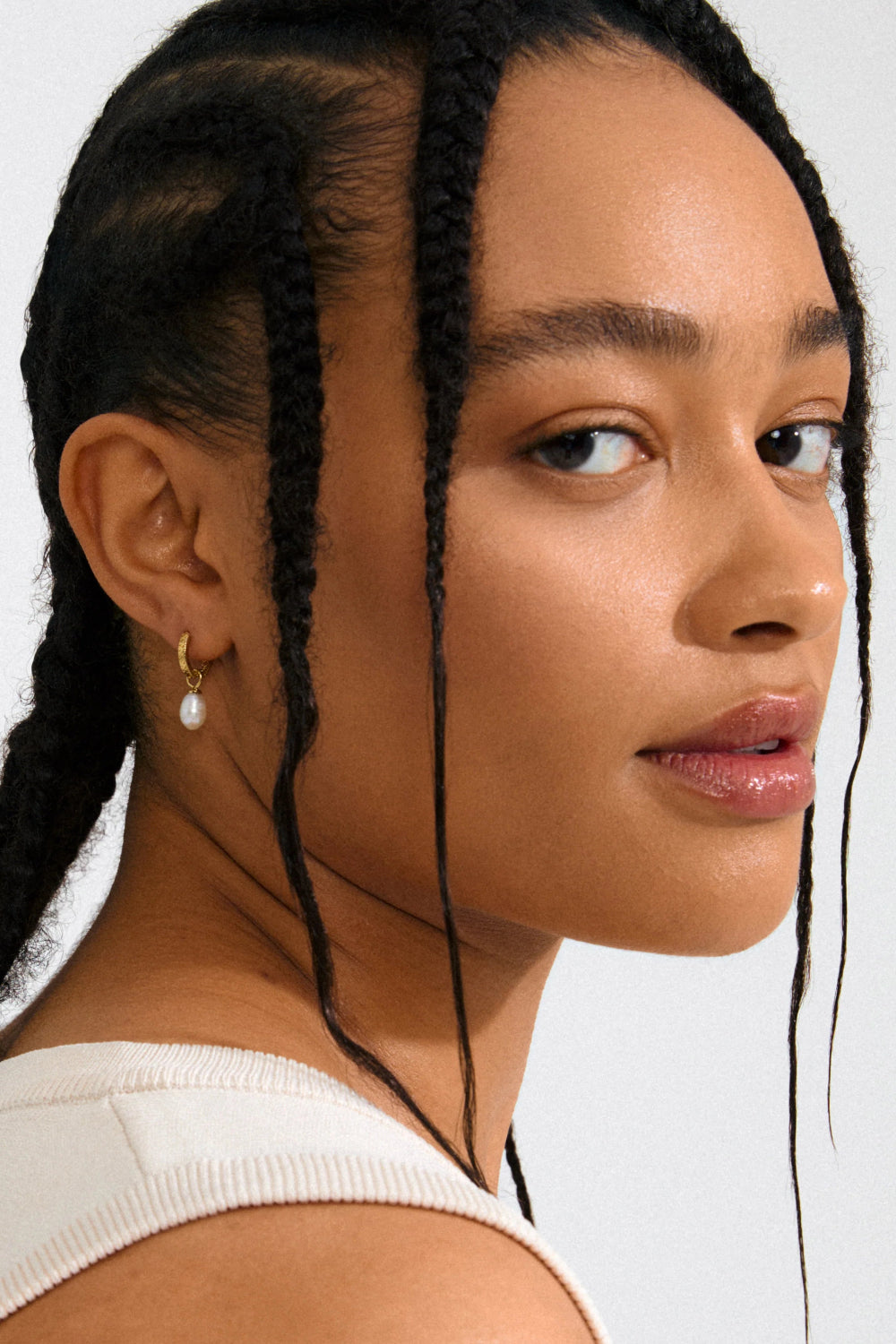 Woman with braided hair wearing a Gold hoop earrings Labasa by Pilgrim available at la petite garçonne