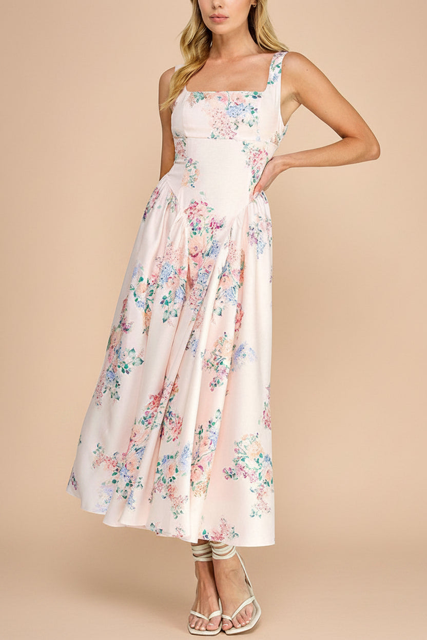 view of a woman wearing Leah A-Line Midi Pink Floral Dress with Ribbons at Back from Boutique 1861