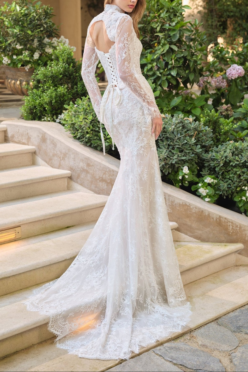 Backview of a Woman wearing Maelie, a strapless lace wedding dress with corset from Boudoir 1861