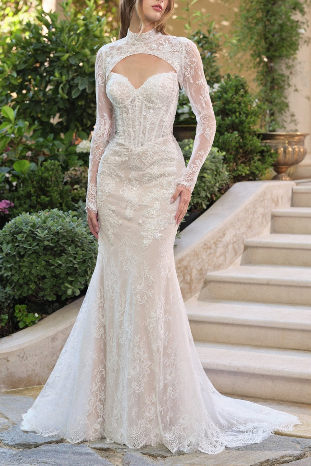 Woman wearing Maelie, a strapless lace wedding dress with corset from Boudoir 1861