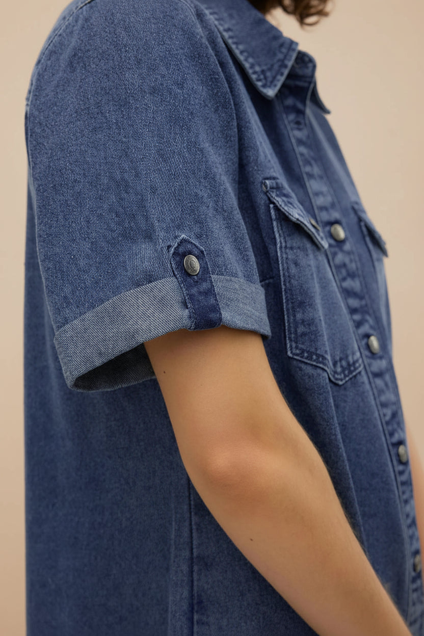 close-up of a woman wearing Malda Short Blue Denim Shirt Dress with Pockets from La petite garçonne