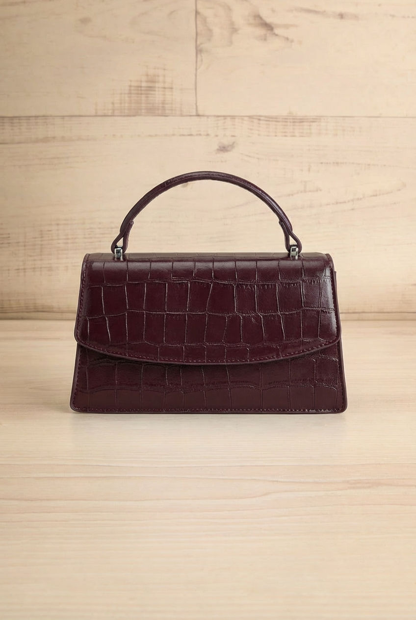 Frontview of the Snakeskin Burgundy handbag named Mackay from la petite garçonne