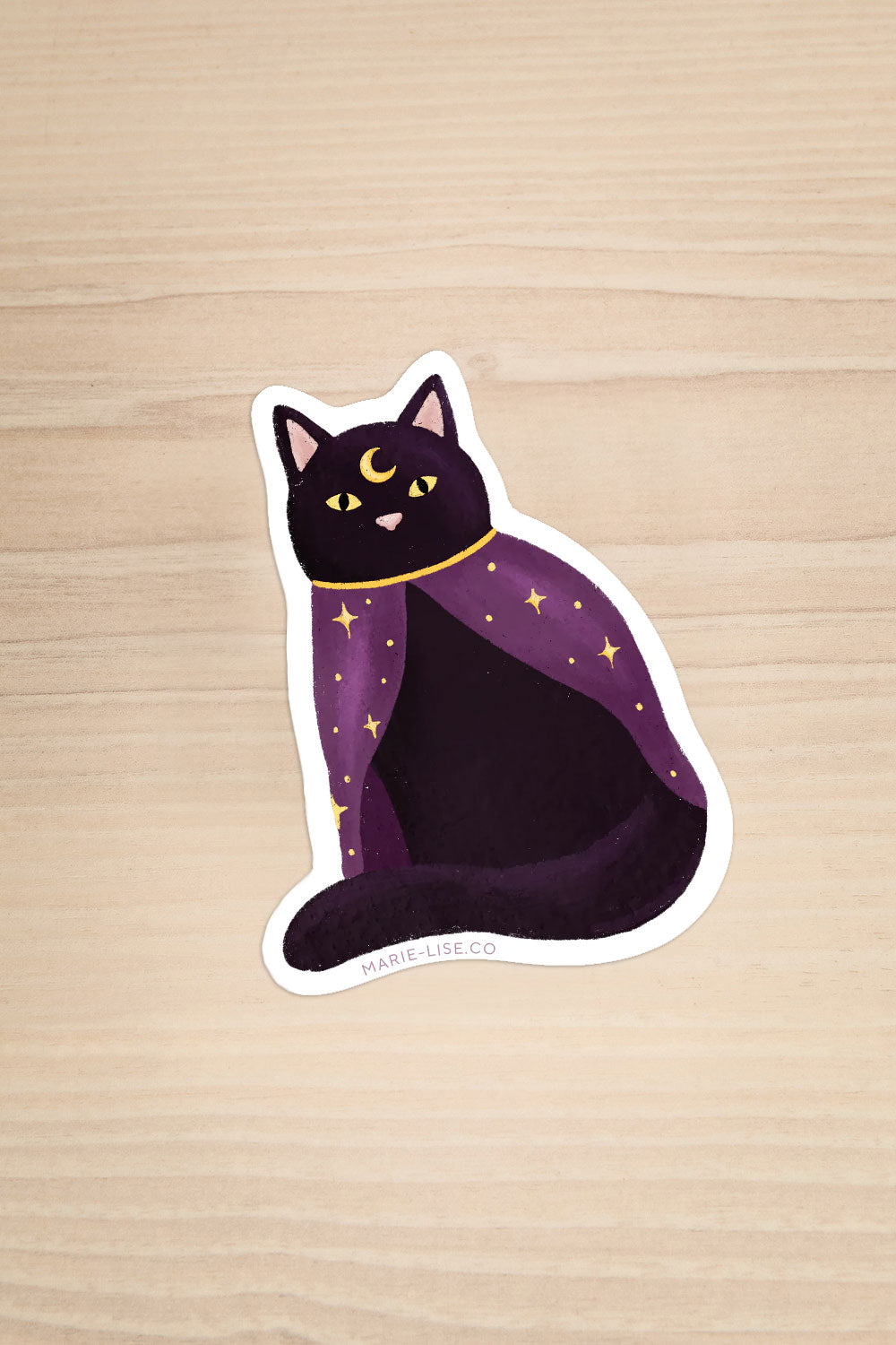 Photo of a Magical Cat Sticker on a wood background