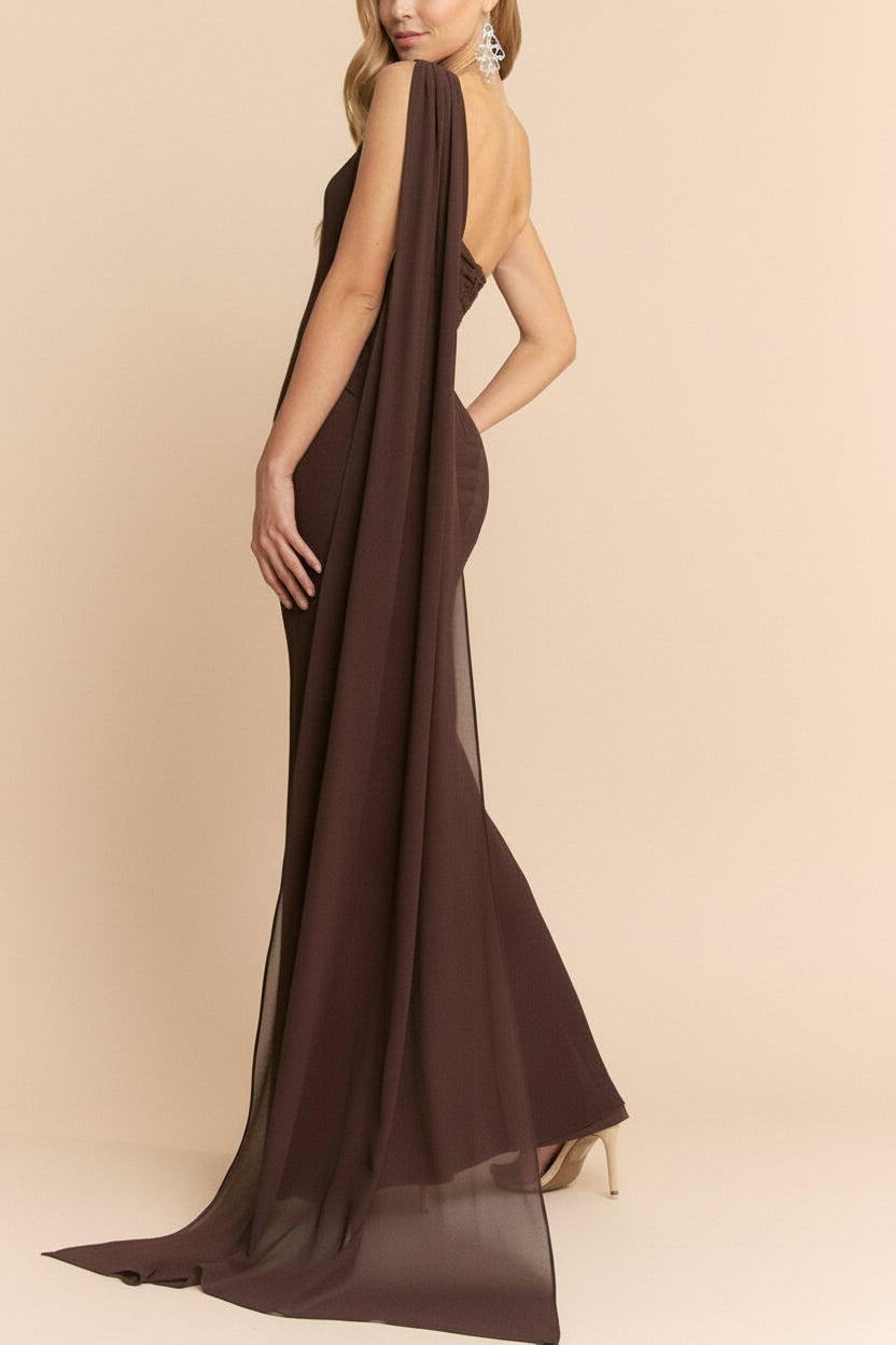 side view of a Woman wearing Makarim Maxi Brown One Shoulder Dress from boutique 1861