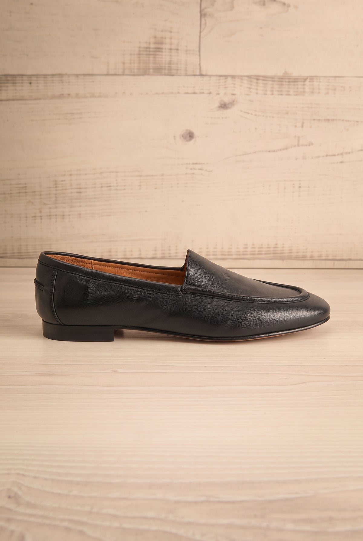 side view of Matty Black Leather Round Toe Loafer Shoes at La petite garçonne