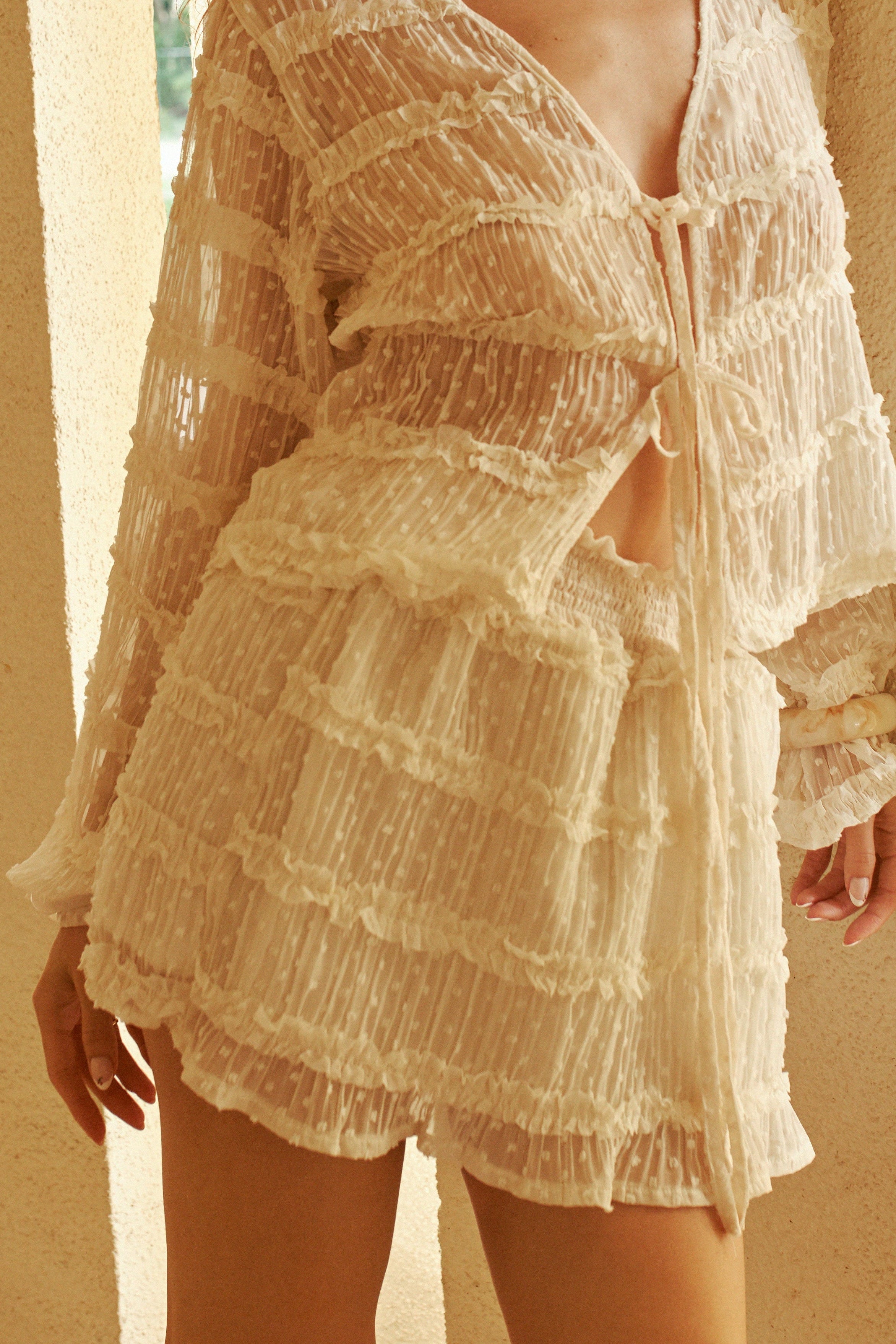 woman wearing Millie Skirt Ivory Short Skirt with Ruffles by Dailystory from la petite garçonne