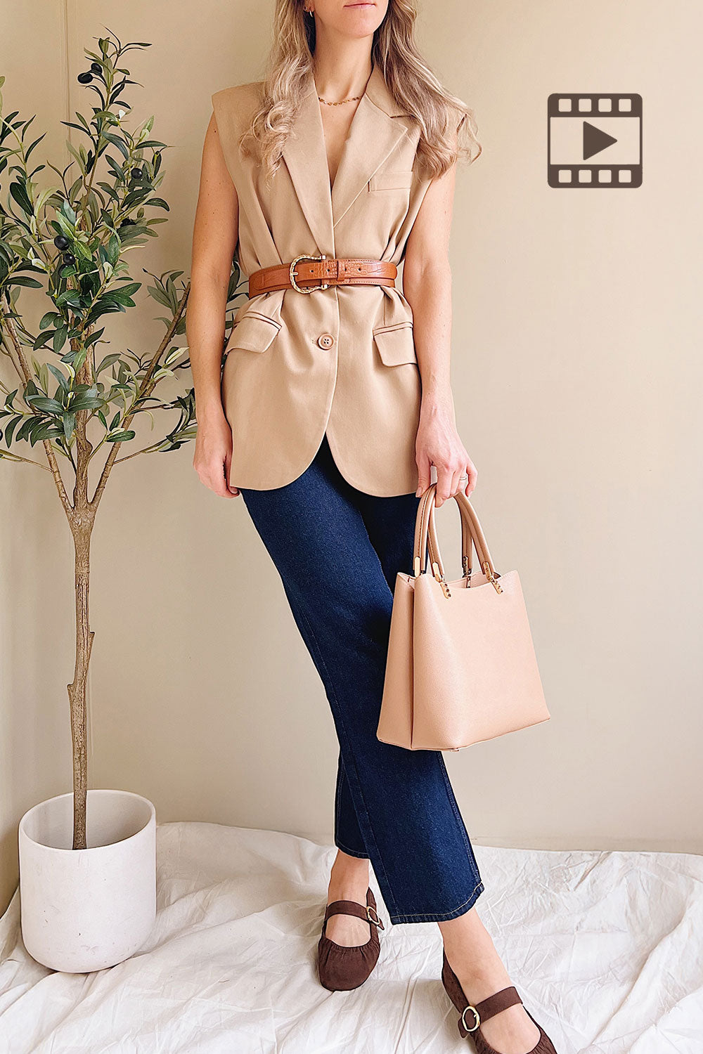 Woman wearing Myret Long Sleeveless Beige Blazer from La petite garçonne with belt