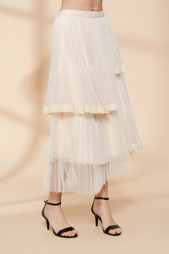 side view of a woman wearing Nadege Pink Maxi Skirt with Lace Trim Detail from Boutique 1861