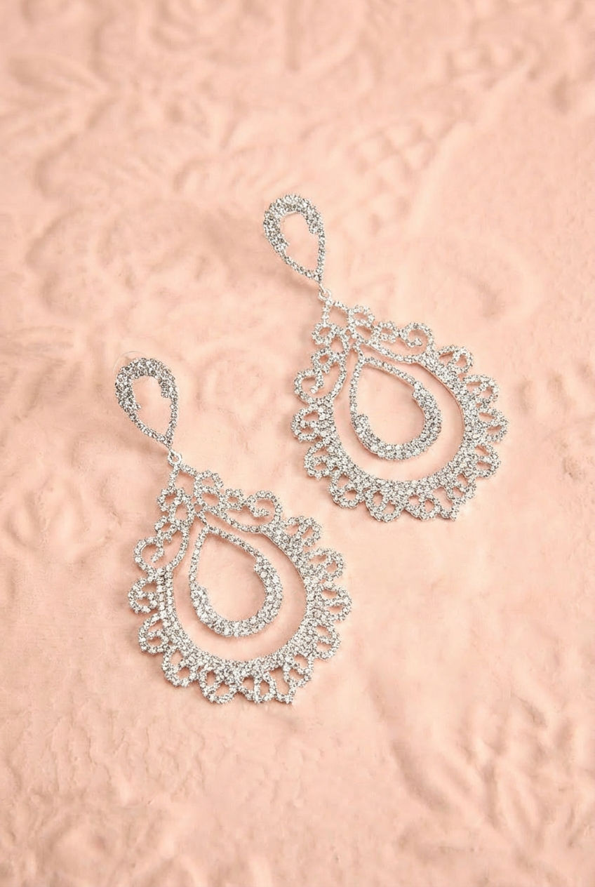 top shot of an elegant Sparkling silver-tone rhinestone layered teardrop dangle earrings from boutique 1861