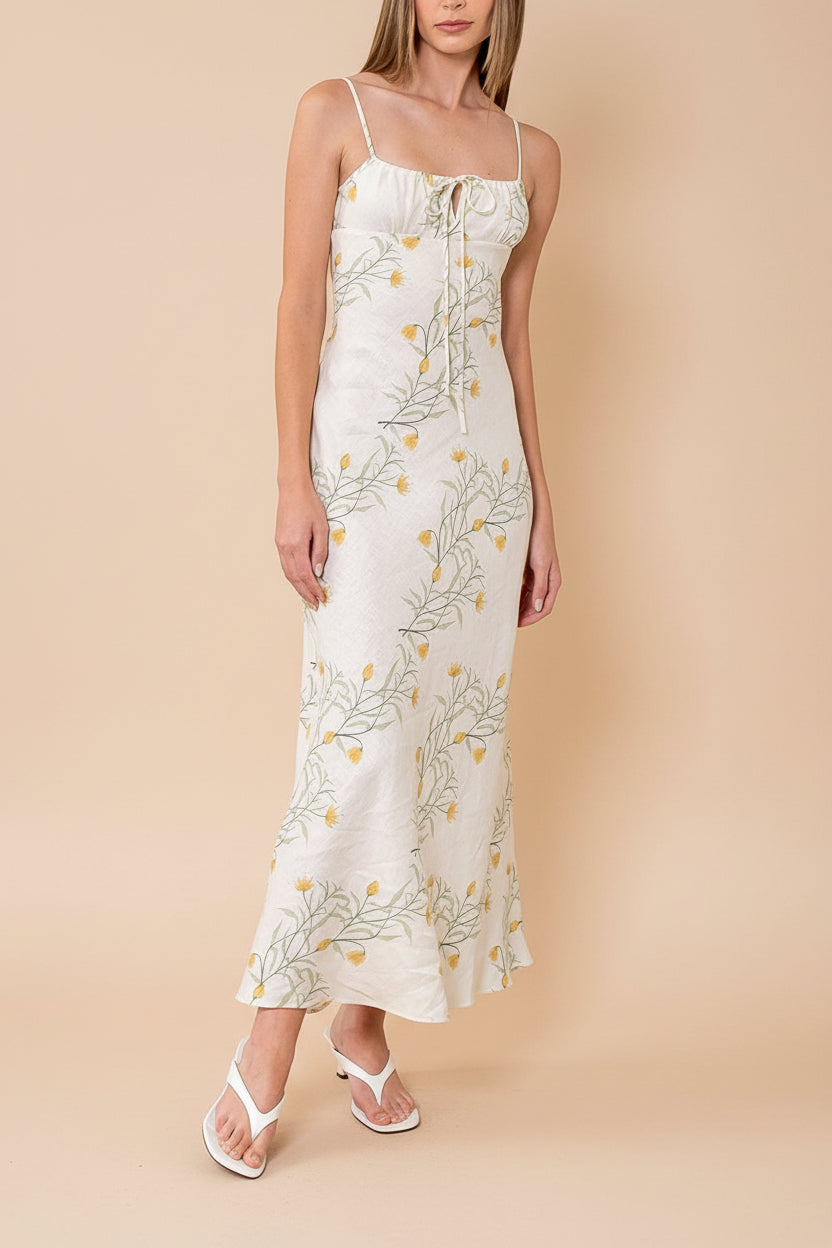 a woman wearing Nevan Ivory Floral Midi Dress with Front Tie Detail from Boutique 1861