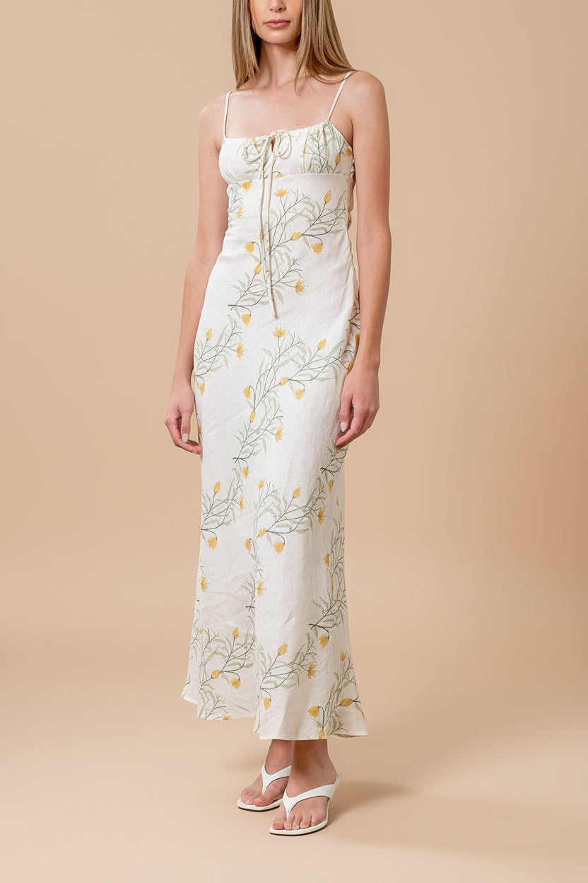 front of a woman wearing Nevan Ivory Floral Midi Dress with Front Tie Detail from Boutique 1861