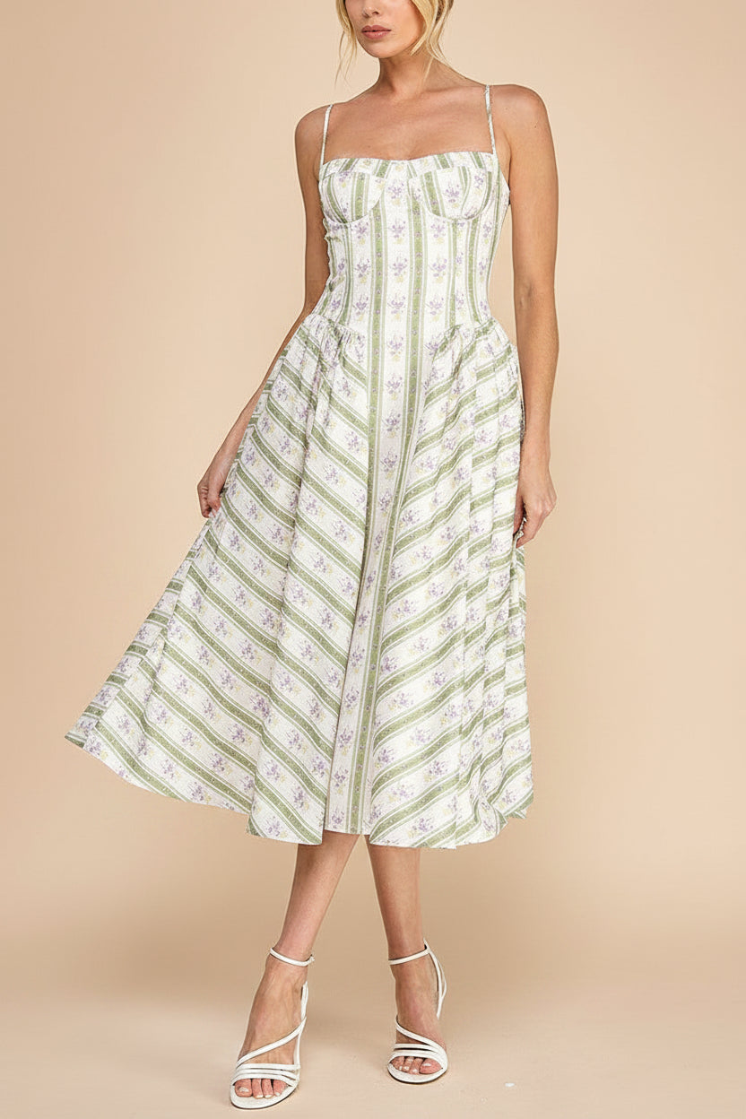 woman wearing Nilaja Floral Stripes Midi Dress with Pockets at boutique 1861