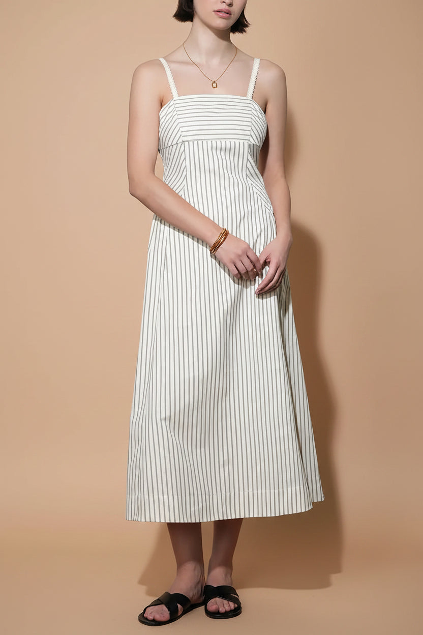 front view of a woman wearing Palashi Ivory Striped Sleeveless Midi Dress with Pockets from Boutique 1861
