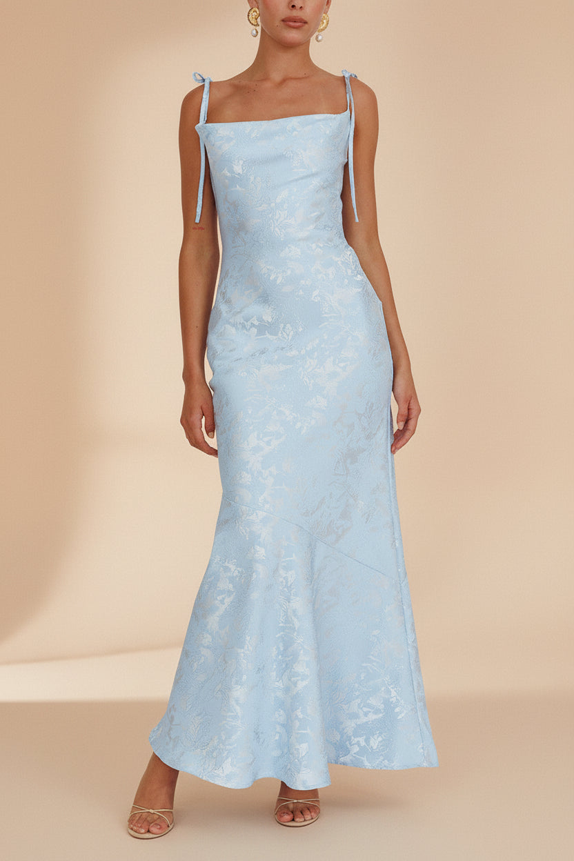 front of a woman wearing Parisia Blue Textured Maxi Mermaid Dress from Boutique 1861