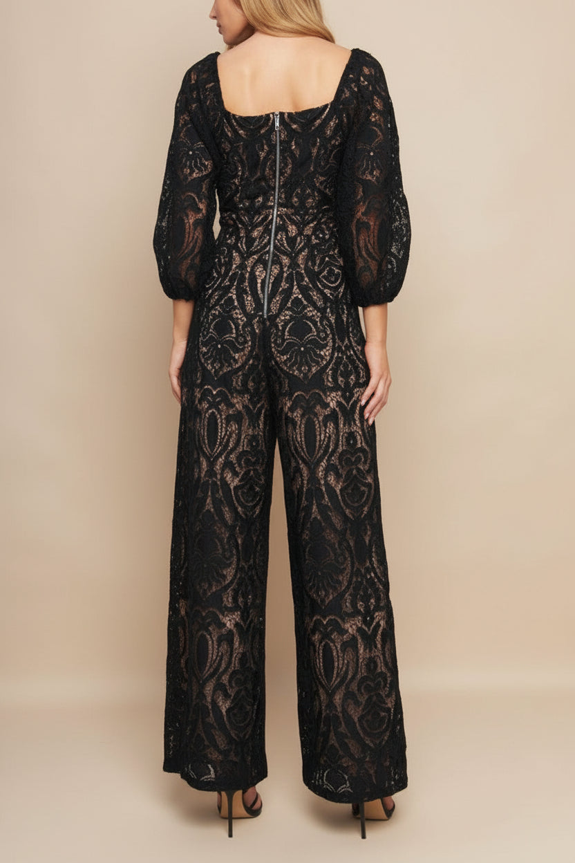back of a woman wearing Penny Black Lace Jumpsuit with Wide-Leg | Boutique 1861