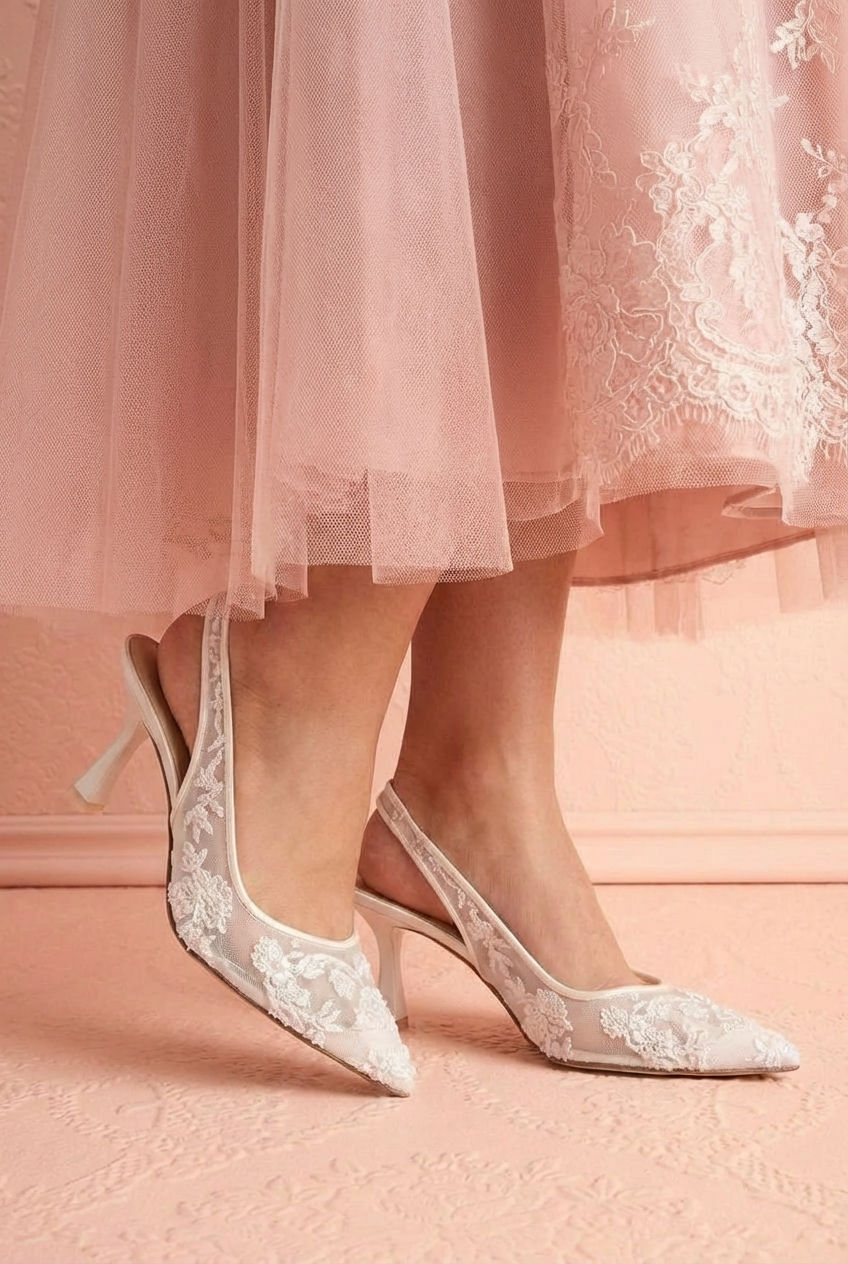 Woman wearing the White Slingback Heels with Embroidery Perseide from Betsey Johnson at boutique 1861