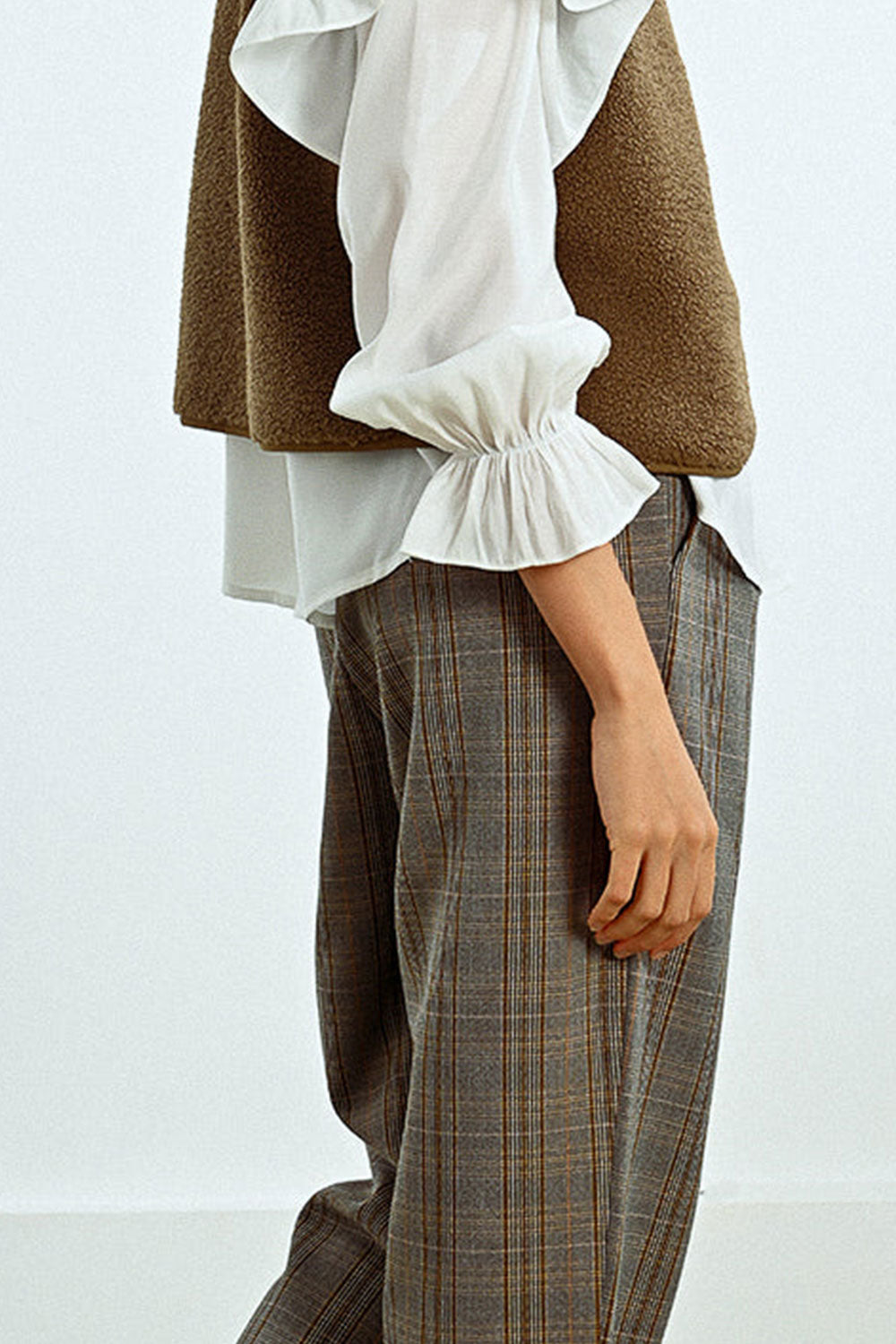 Photo of model wearing Plano High-Waisted Plaid Pants sideview from La petite garçonne