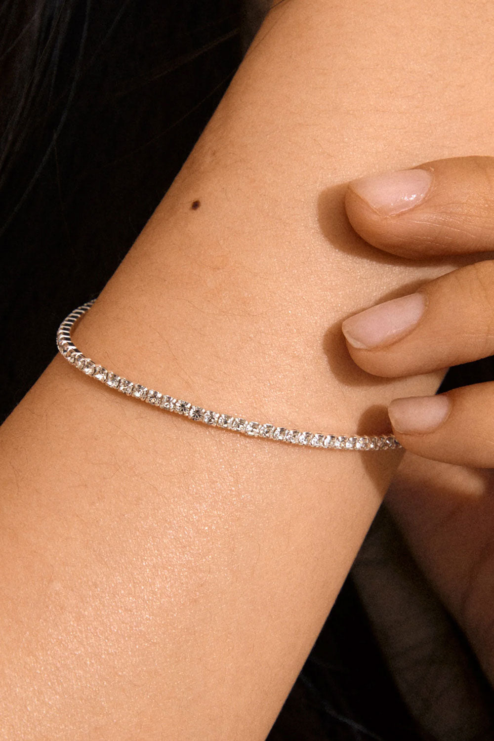 Close up of a woman wearing a Silver bracelet ARASH from Pilgrim available at La petite garçonne in Montreal