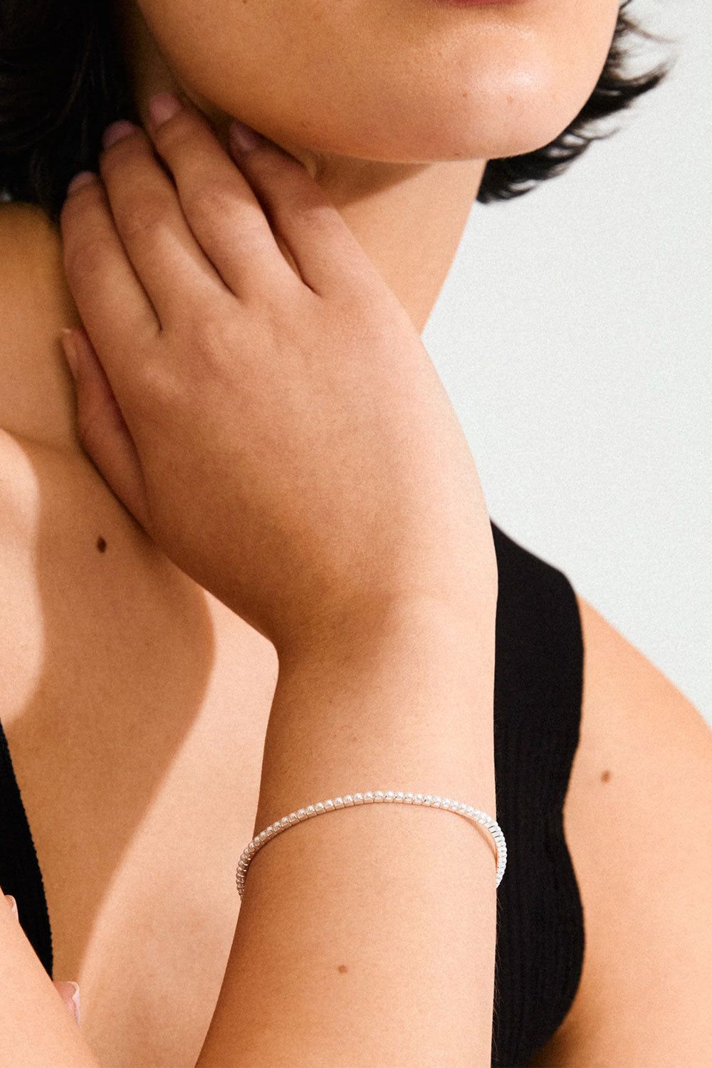 Close-up of a hand wearing a beaded silver bracelet ARASHIA from Pilgrim available at la petite garçonne in Montreal