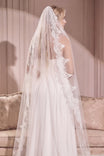 Woman wearing Polaris White Tulle Wedding Veil with Lace from Boudoir 1861