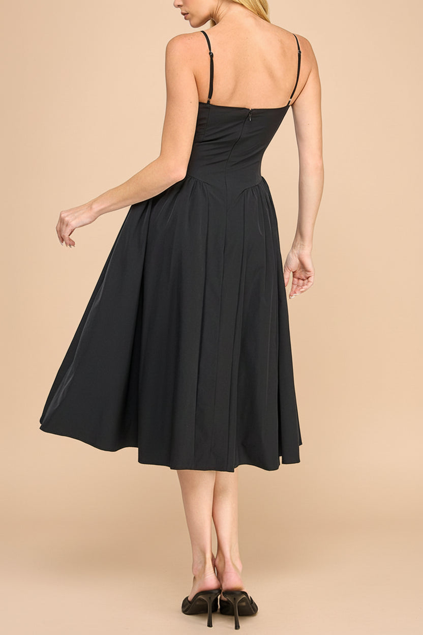 back view of a woman wearing Rhonda Black Bustier Midi Dress with Flared Skirt from Boutique 1861