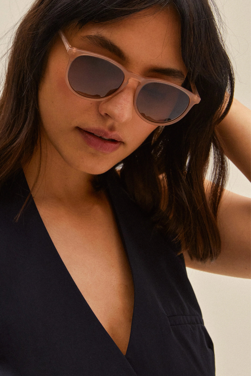 Woman wearing brown sunglasses by Pilgrim available at la petite garçonne