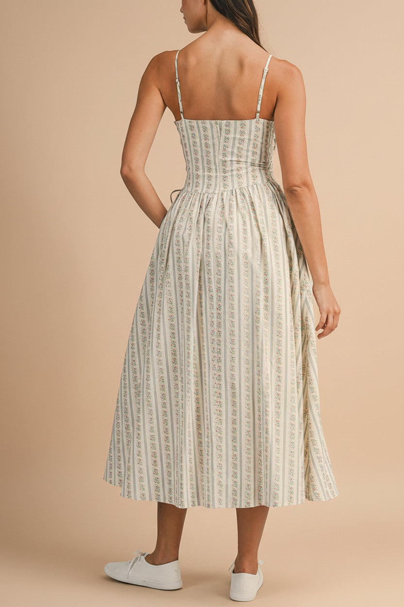 back view of a woman wearing Saratou Floral Stripe Maxi Dress with Side Lace-Up Detail from Boutique 1861