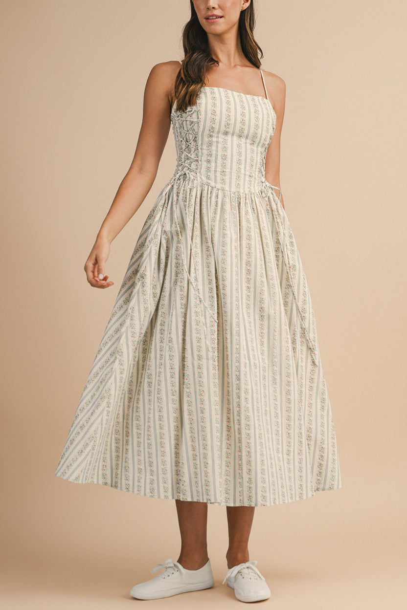 front view of a woman wearing Saratou Floral Stripe Maxi Dress with Side Lace-Up Detail from Boutique 1861