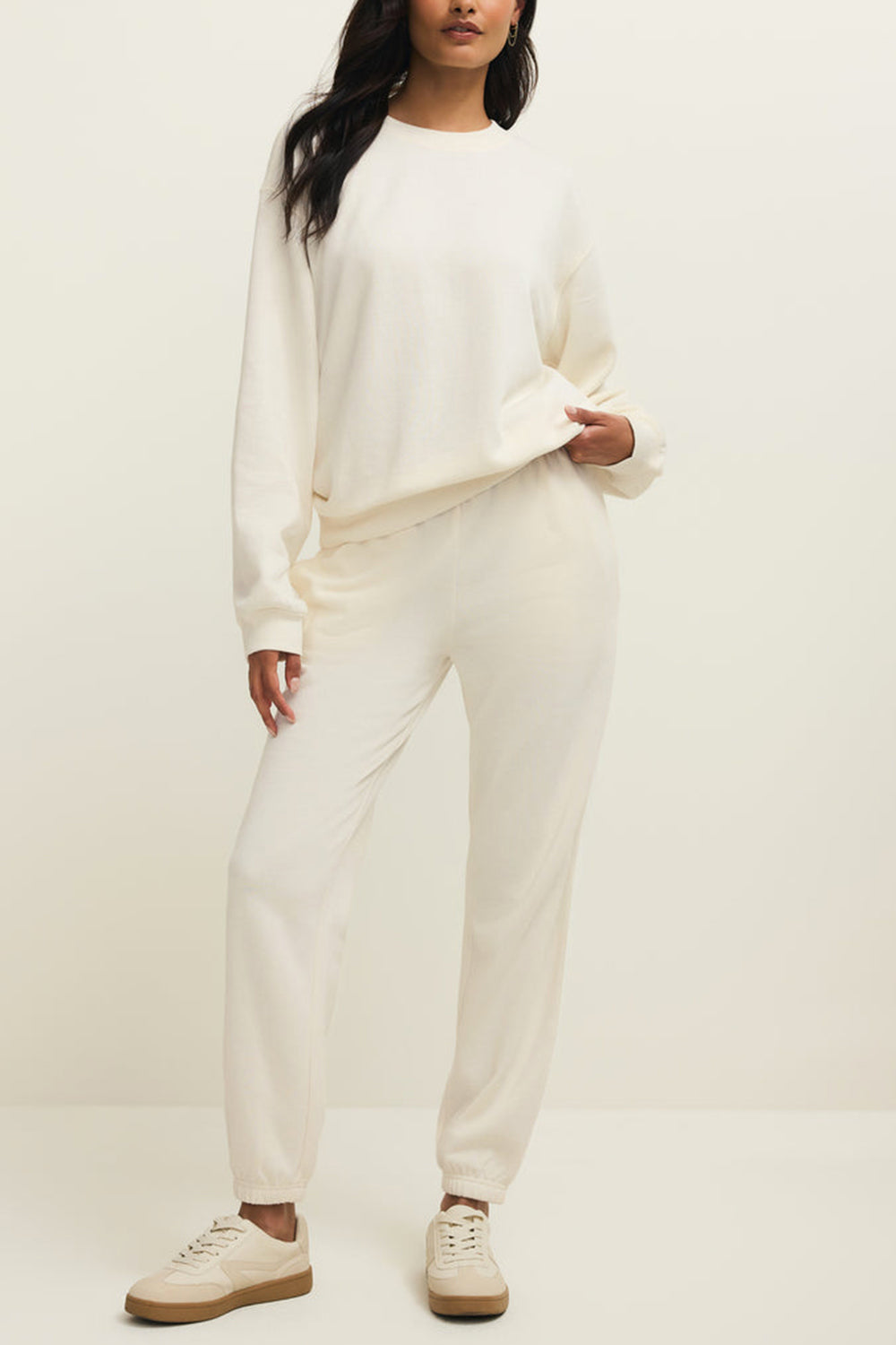 front of a woman wearing Satara White Wide Leg Jogger Pants from La petite garçonne