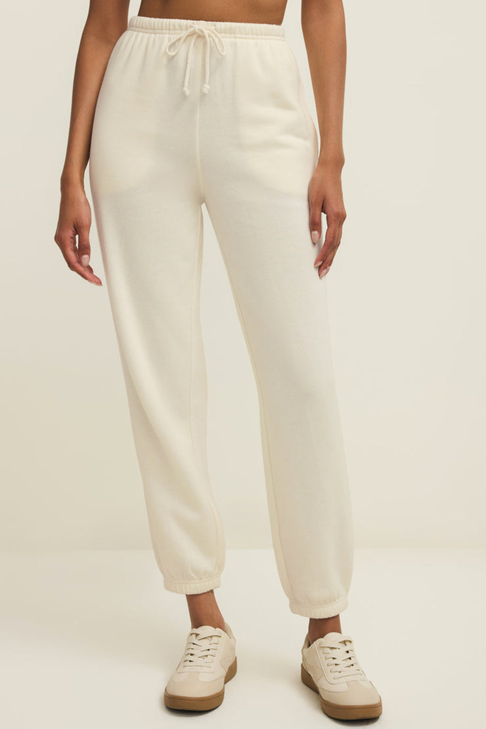 front close-up of a woman wearing Satara White Wide Leg Jogger Pants from La petite garçonne