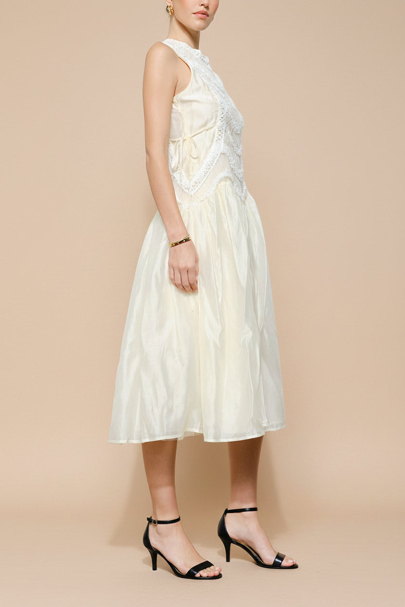 side view of a woman wearing Shania Ivory Sleeveless Midi Dress with Textured Details from Boudoir 1861