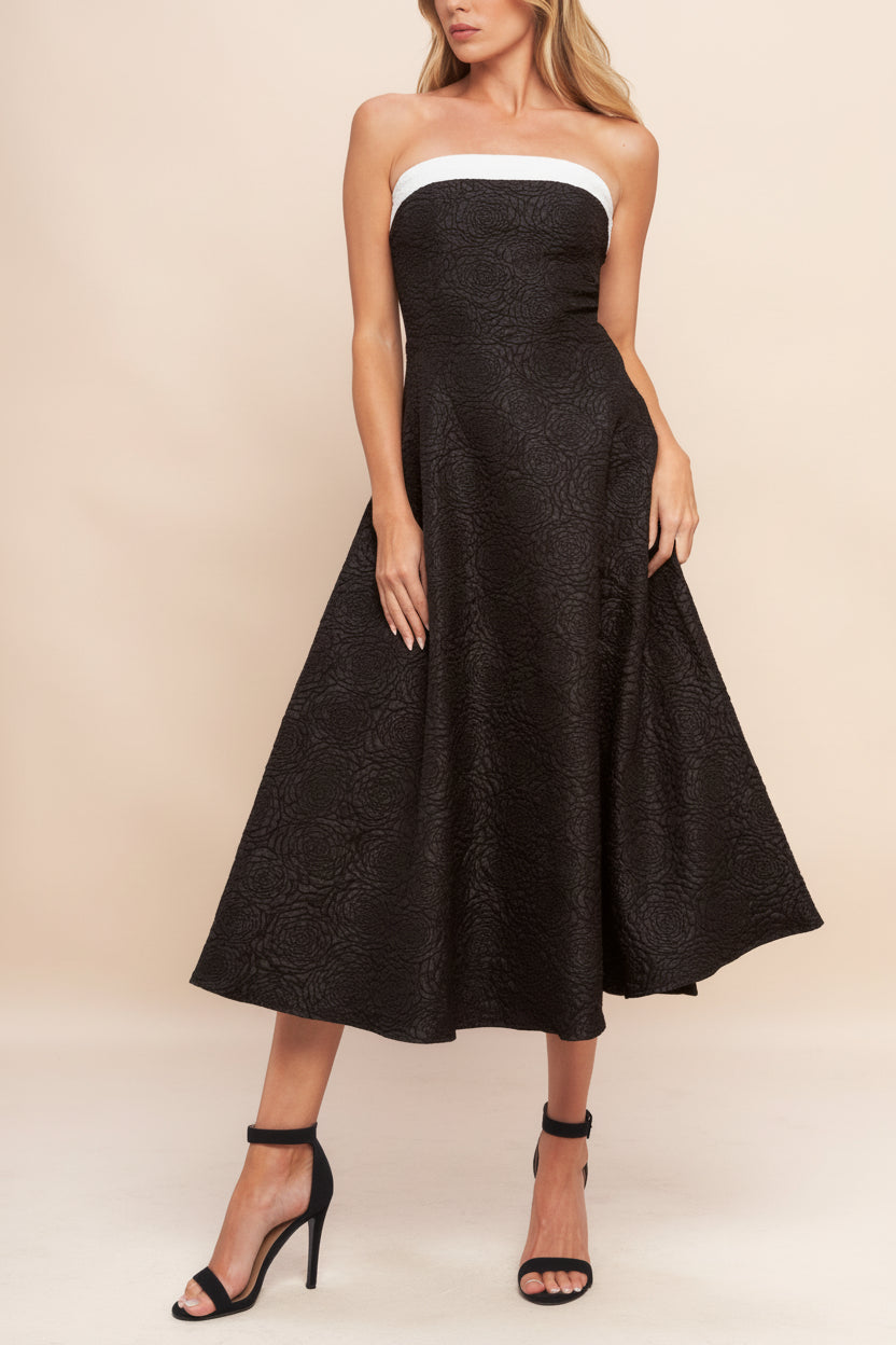 Front view of a woman wearing Solana Black Dress with Floral Waffled Texture from boutique 1861