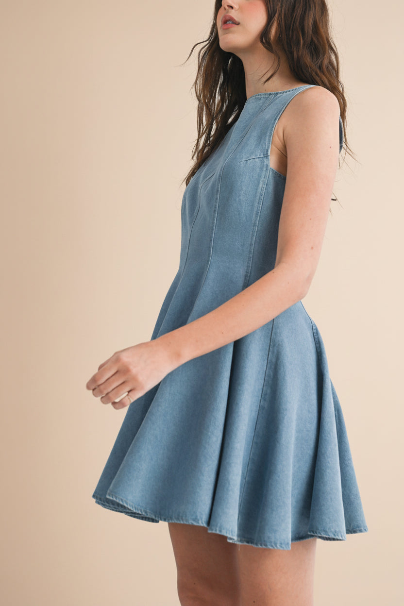 profile Woman wearing Sorrento Blue Sleeveless Denim Short A-Line Dress at la petite garçonne
