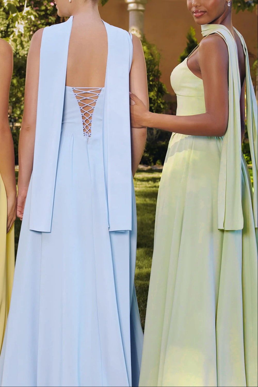 back of a woman wearing Syana Sage Long Chiffon Corset Dress from Boutique 1861