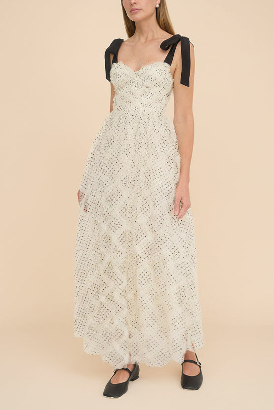 front view of a woman wearing Takako Long White Tulle Dress with Black Polka Dots from Boutique 1861