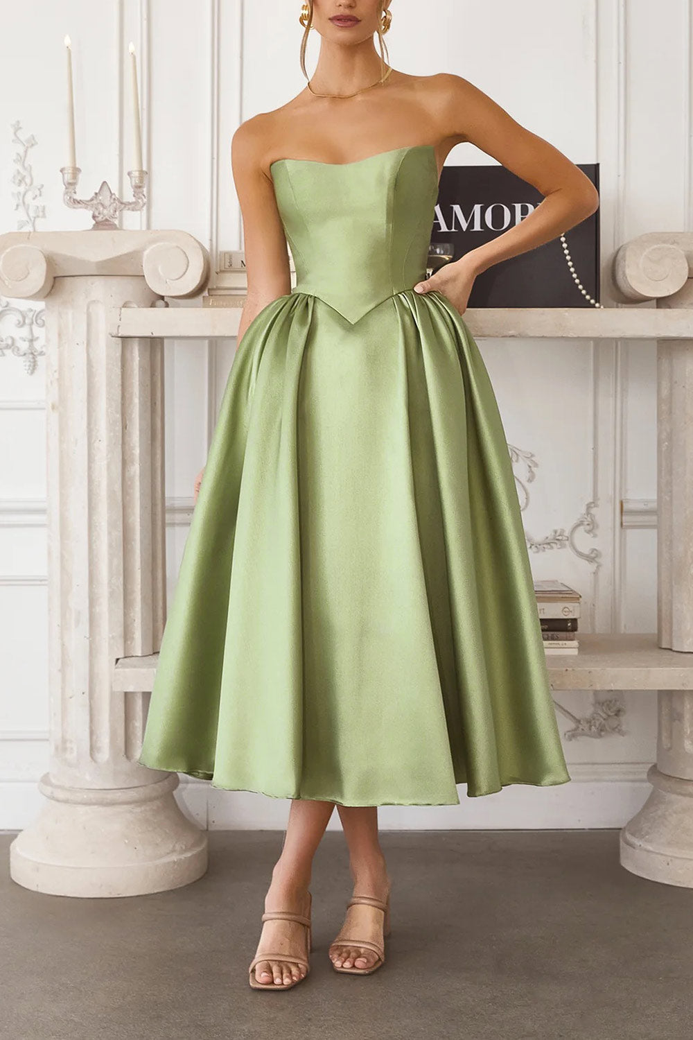 front of a woman wearing Thalya Sage Long Satin Dress with Fitted Bodice and Pockets from Boutique 1861