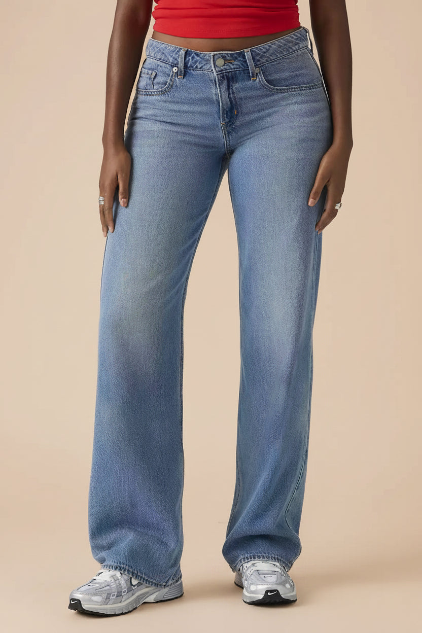 front close-up of a woman wearing Tuscania Low Rise Blue Denim Pants from La petite garçonne