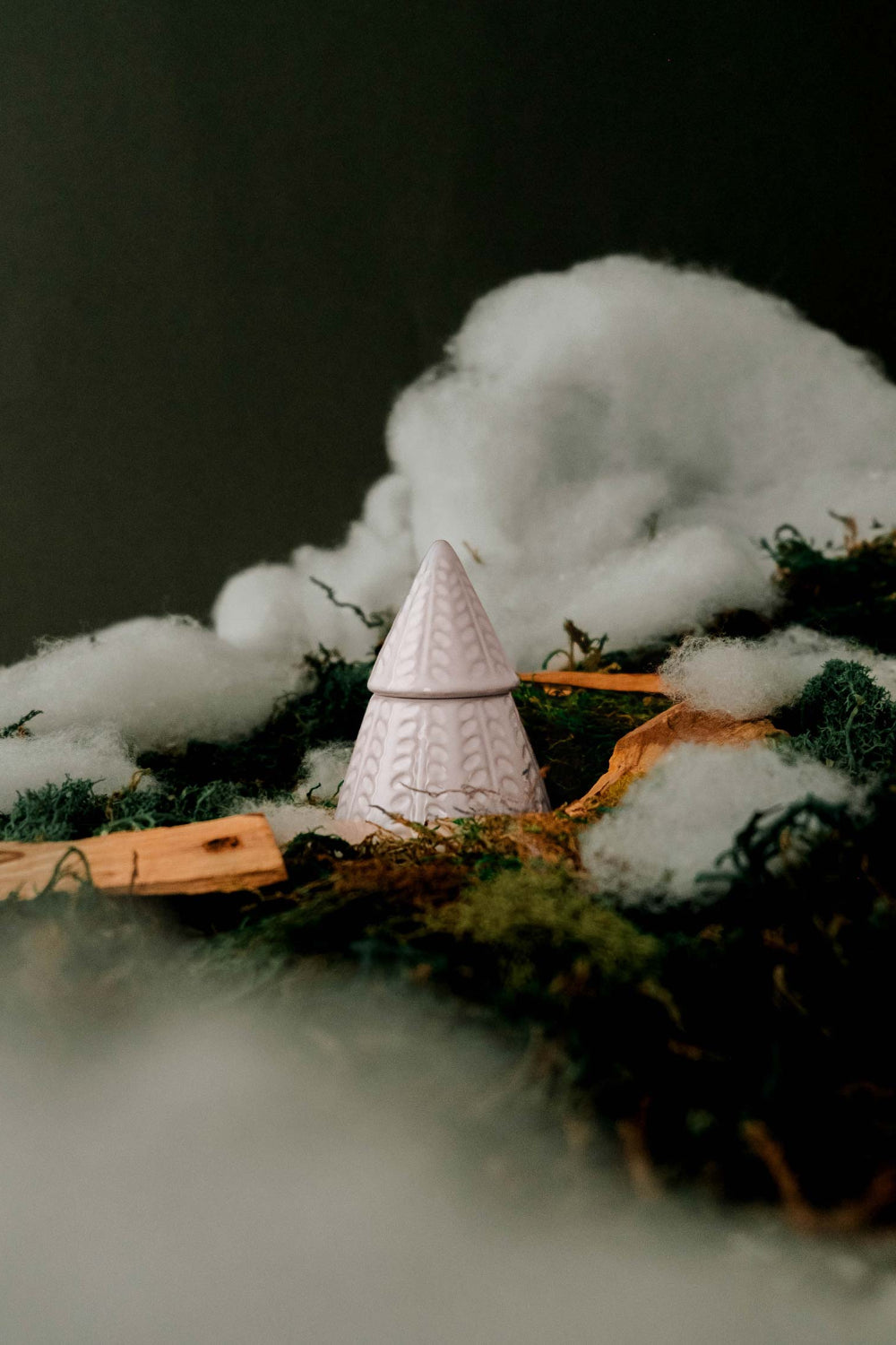 The Little Fir Tree Candle by mimi and august in a textured holder with cotton and greenery