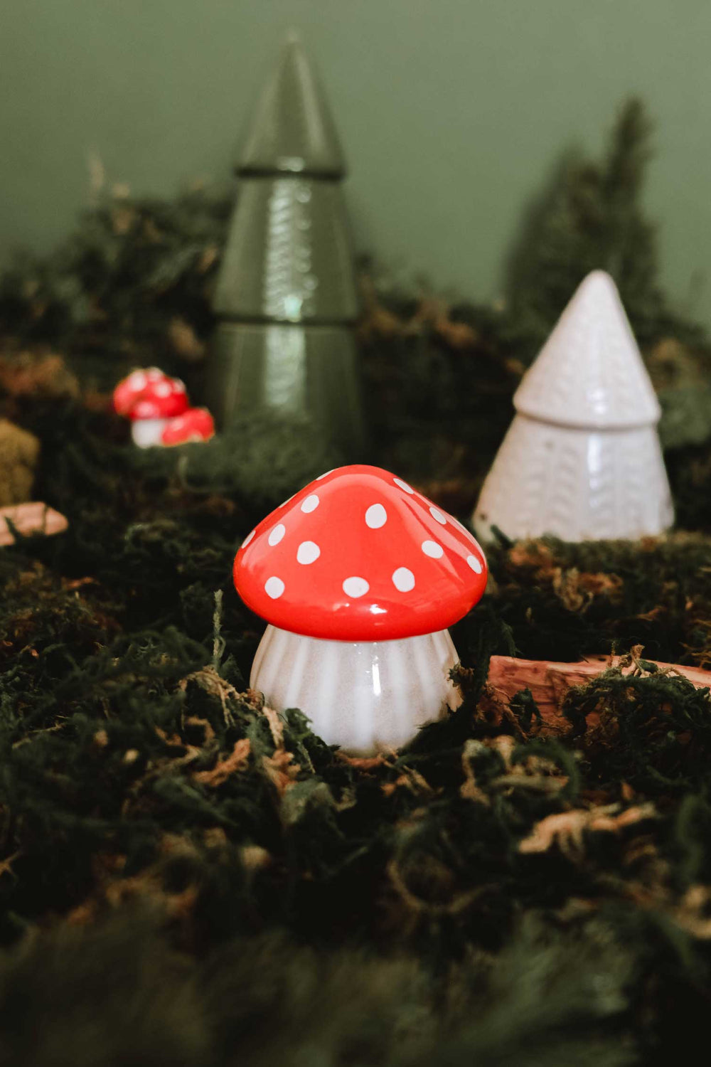 Decorative christmas little mushrooms candle with red spots on a bed of moss by Mimi & August