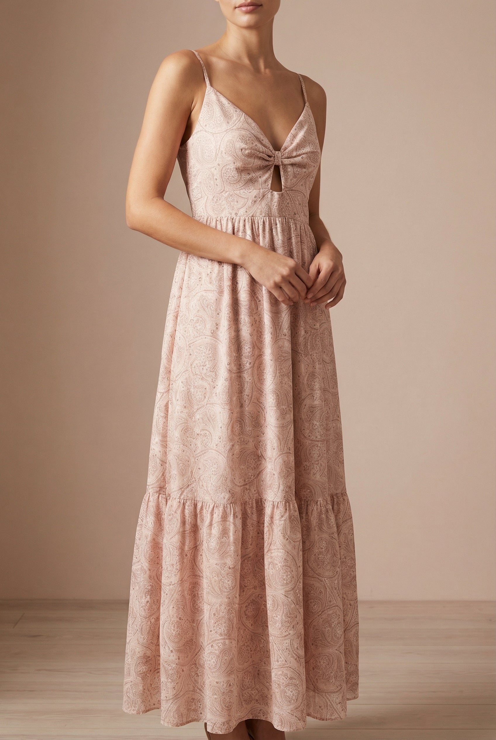 Frontview of a woman wearing Ting Pink Paisley Maxi Dress from Boutique 1861