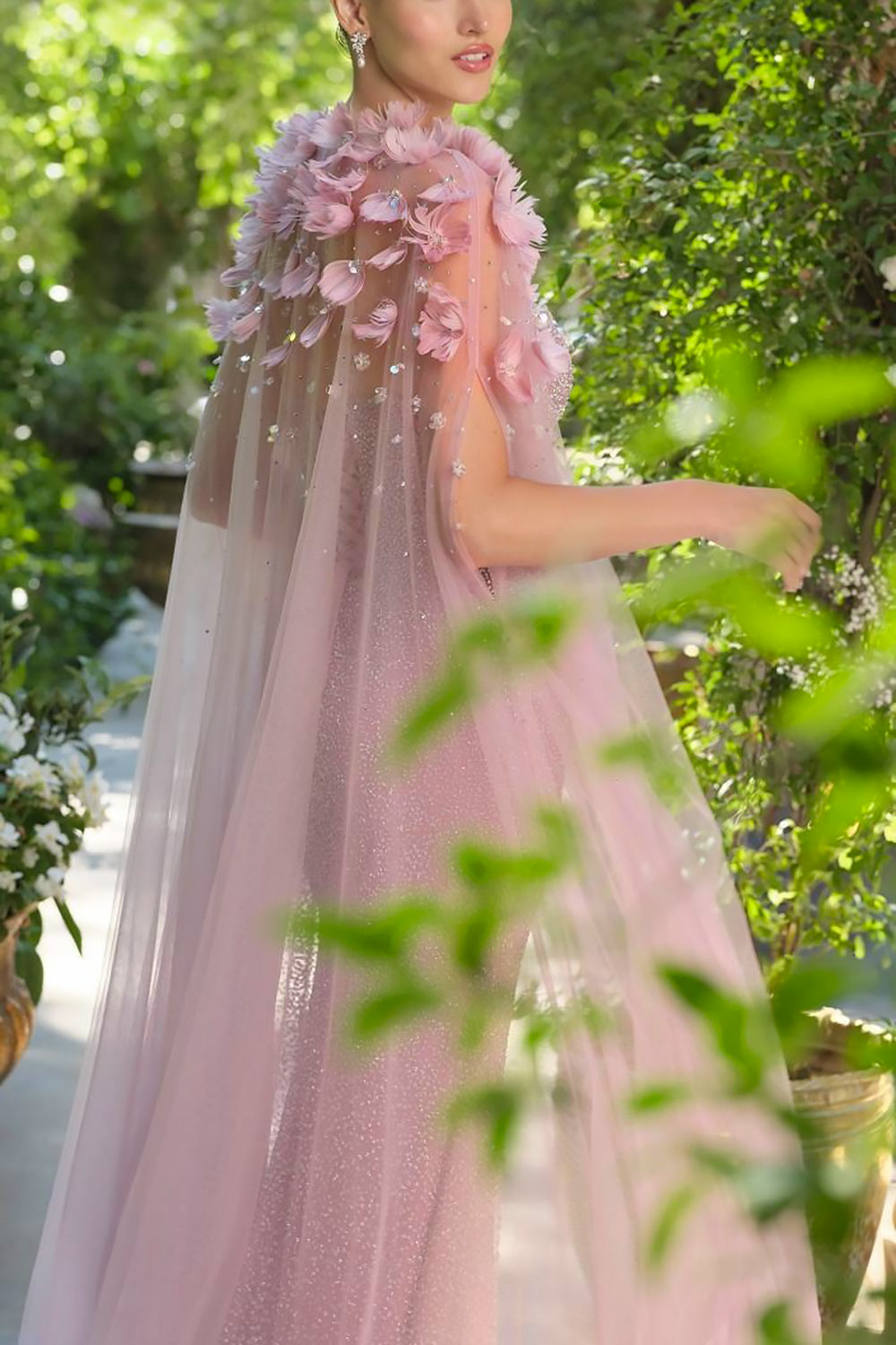 close-up of a woman wearing Volina Mauve Floral Embroidered Tulle Cape with Feathers from Boudoir 1861