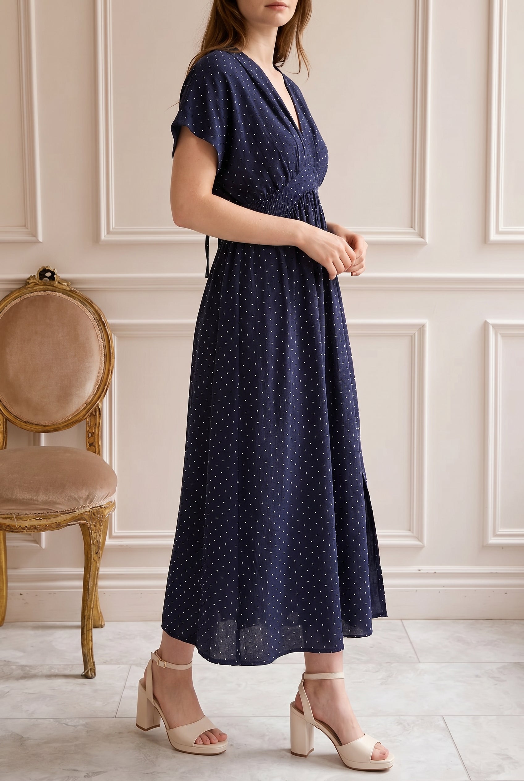 Woman wearing Daoren Polka Dots Navy Midi Dress with Slit at boutique 1861