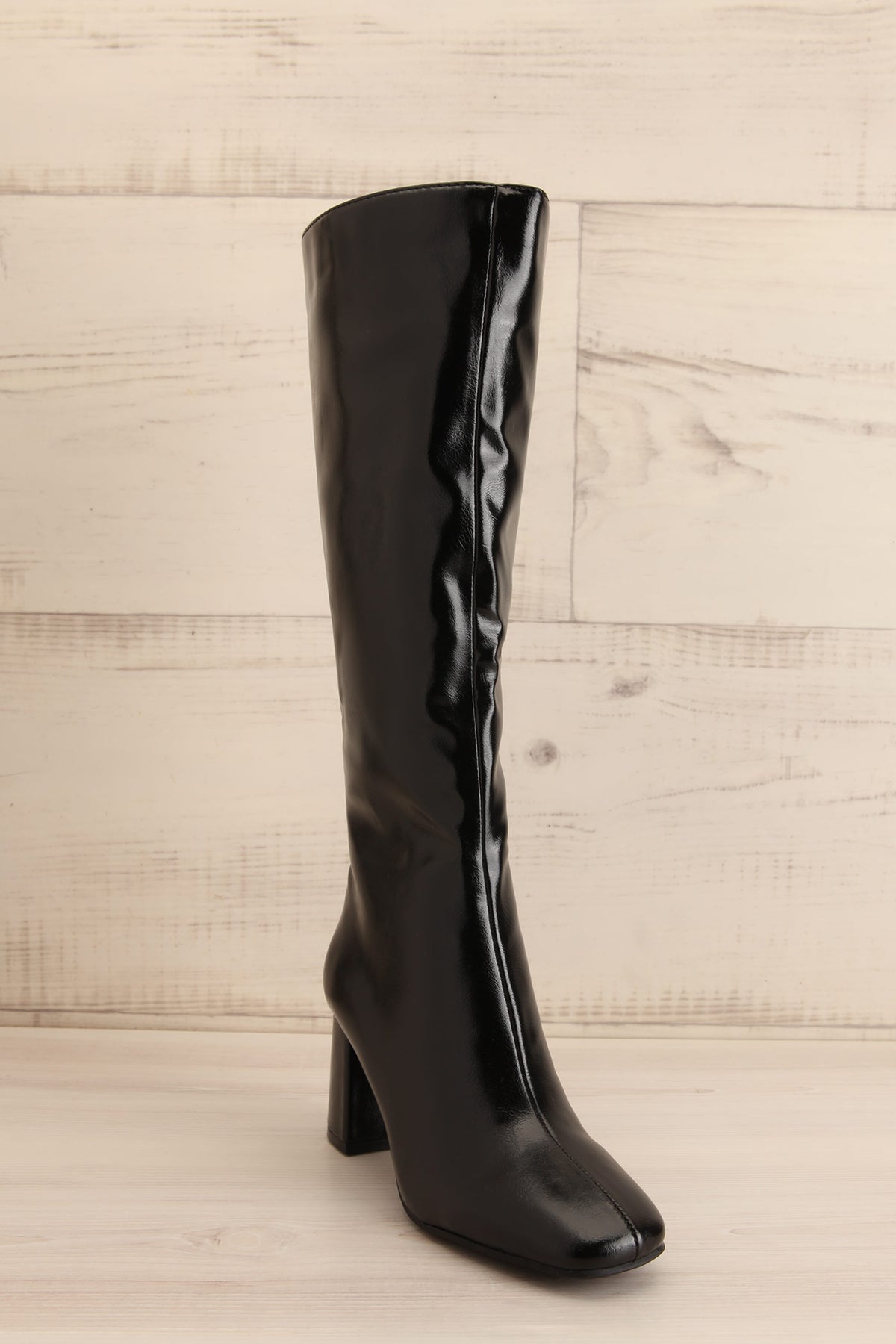 side view of Ahrensburg Black Faux Leather Boots at La petite garçonne