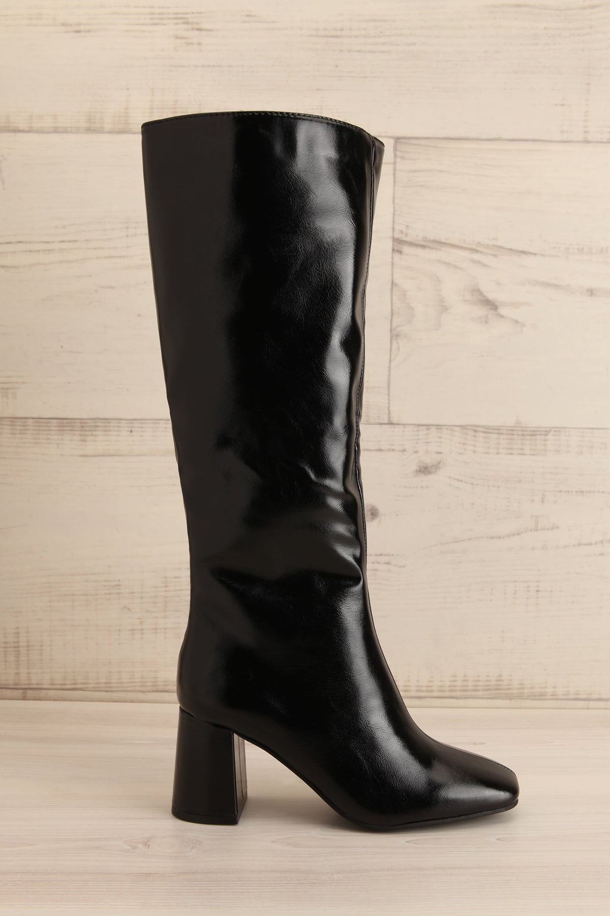 front view of Ahrensburg Black Faux Leather Boots at La petite garçonne